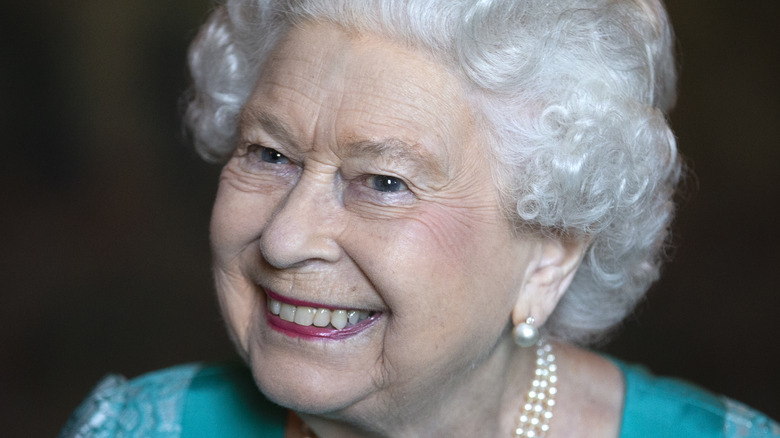 Queen Elizabeth smiles for a photo. 