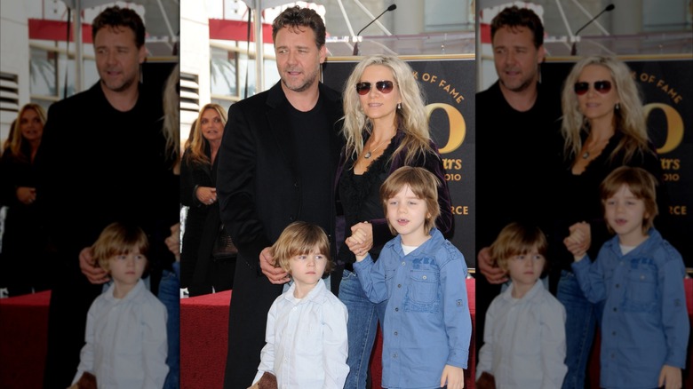 Russell Crowe and Danielle Spencer holding hands with their two kids