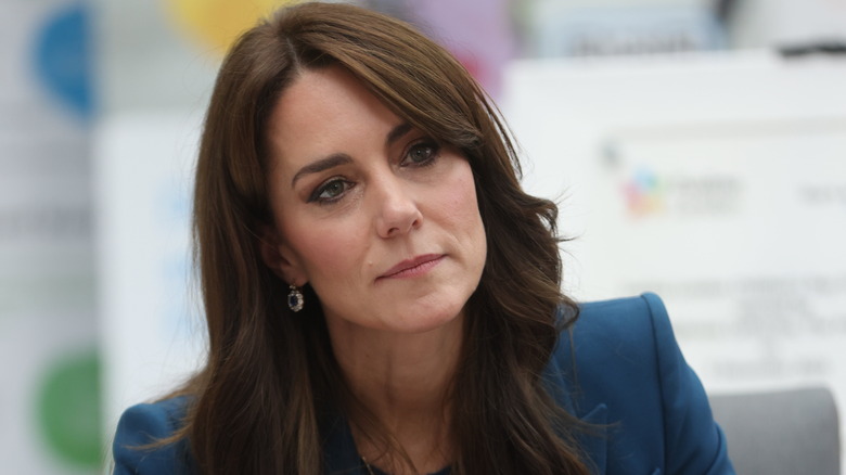 Kate Middleton head cocked looking serious
