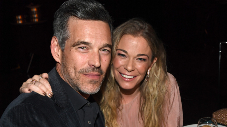 LeAnn Rimes with her arm around Eddie Cibrian