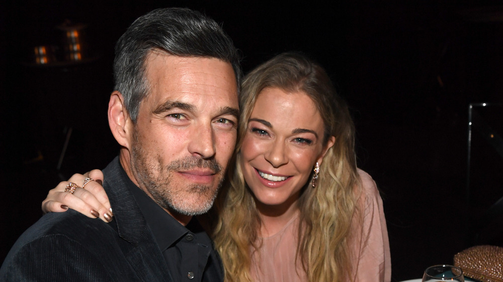 LeAnn Rimes with her arm around Eddie Cibrian