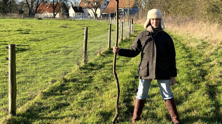 Mia Sara posing on her farm