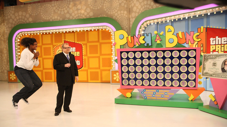 Excited contestant next to Drew Carey