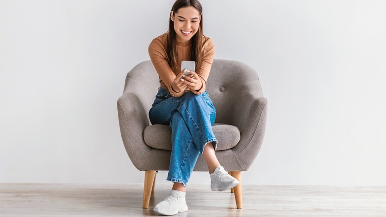 Woman sitting with legs crossed