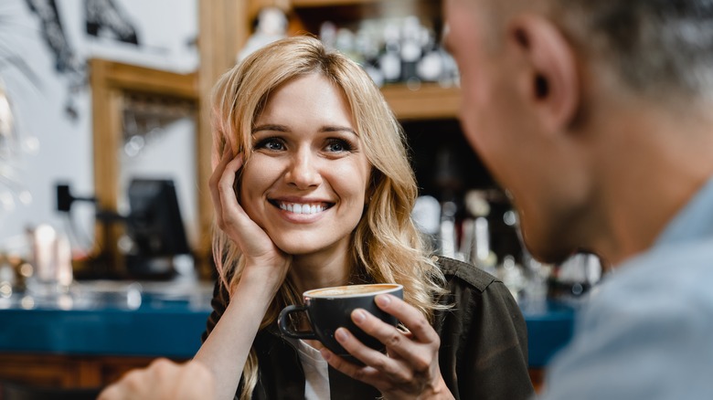 woman grinning at man