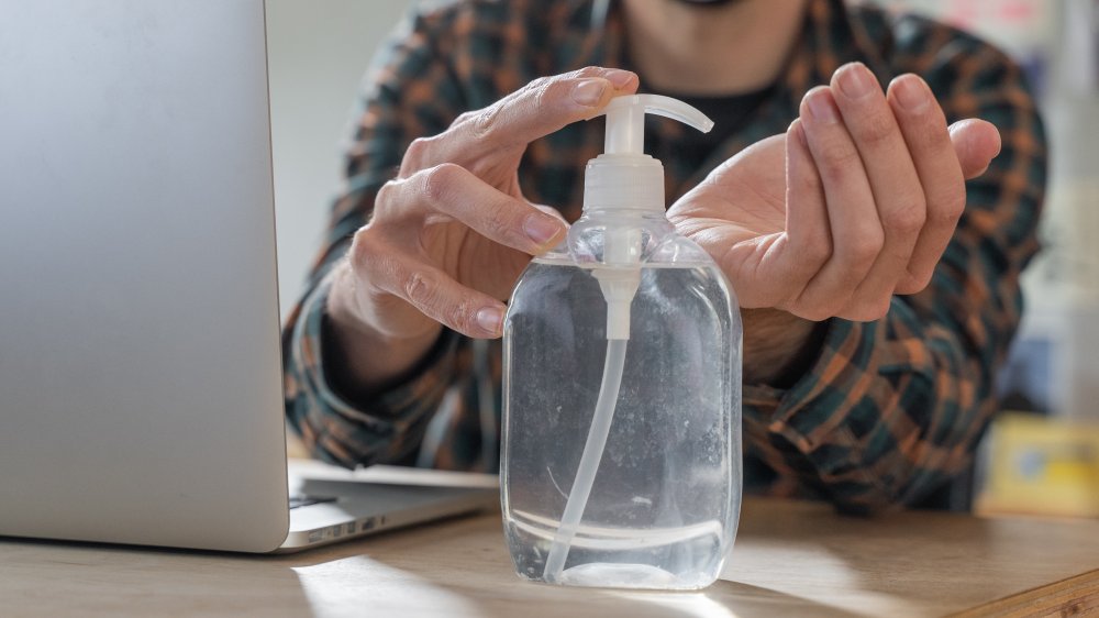 Man using hand sanitizer