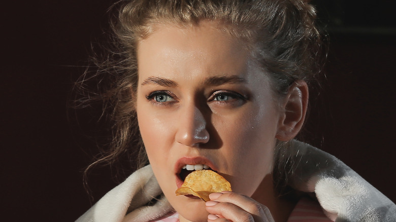 woman eating chips 