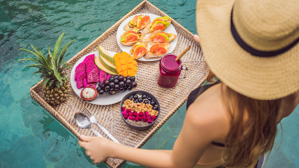 Woman holding tray of food