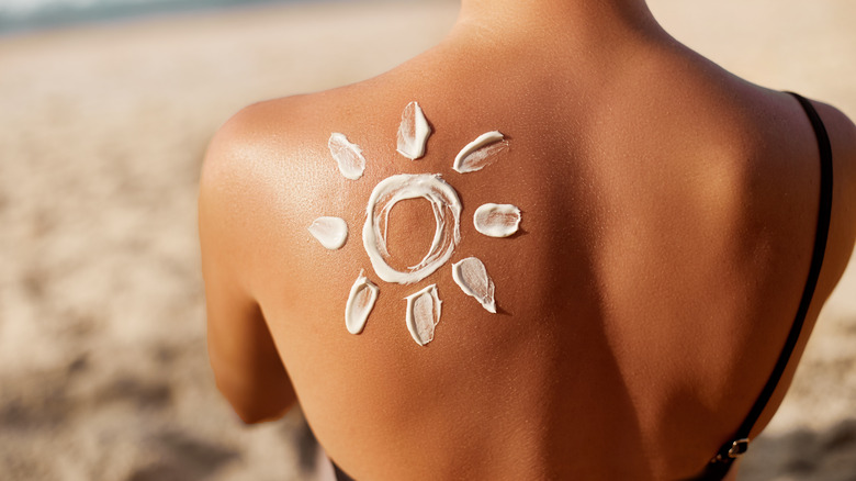 Woman tanning at the beach