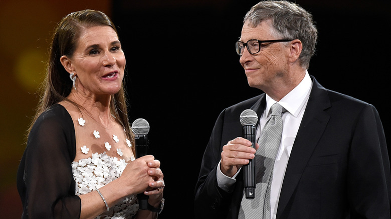 Melinda French Gates and Bill Gates holding microphones