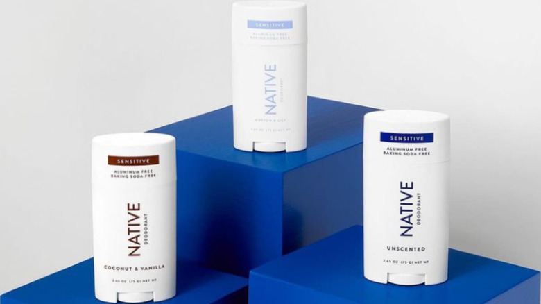 Native deodorants on blue pedestal