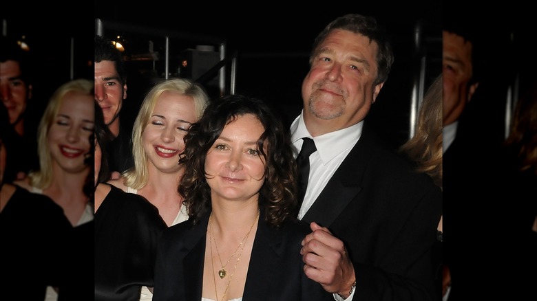 Lecy Goranson, Sara Gilbert, and John Goodman posing together