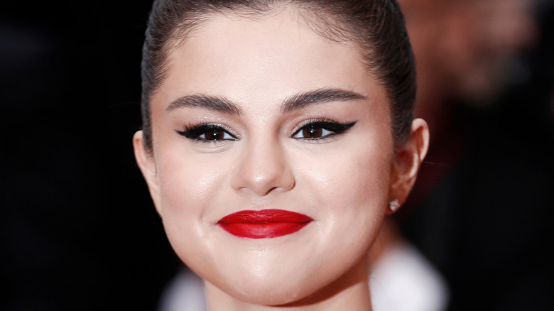 Selena Gomez smiles at an event