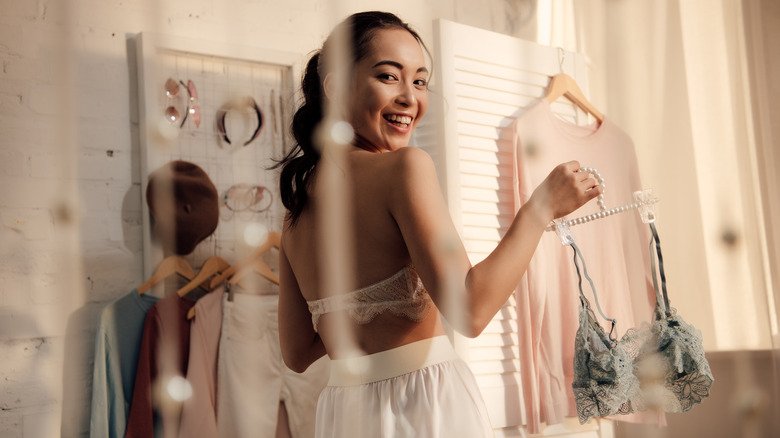 smiling woman looking over shoulder