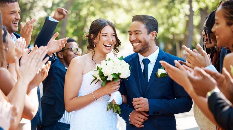 Bride and groom walking down aisle