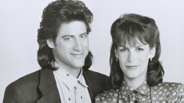 Jamie Lee Curtis and Richard Lewis smiling in a photoshoot for 