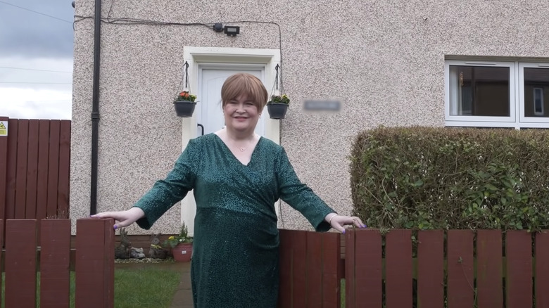 Susan Boyle in front of her home 