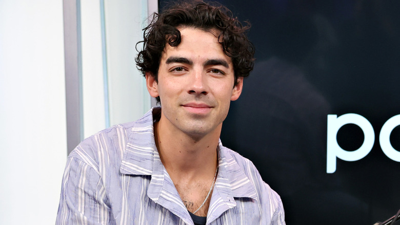 Joe Jonas smiling at the camera