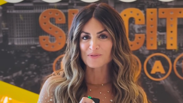 Alison Victoria in front of "Sin City Rehab" logo