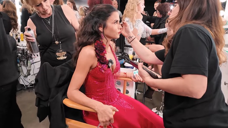 Jenna Dewan getting her makeup touched up backstage during an episode of DWTS