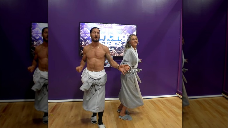 Alix Earle and Val Chmerkovskiy rehearsing backstage during an episode