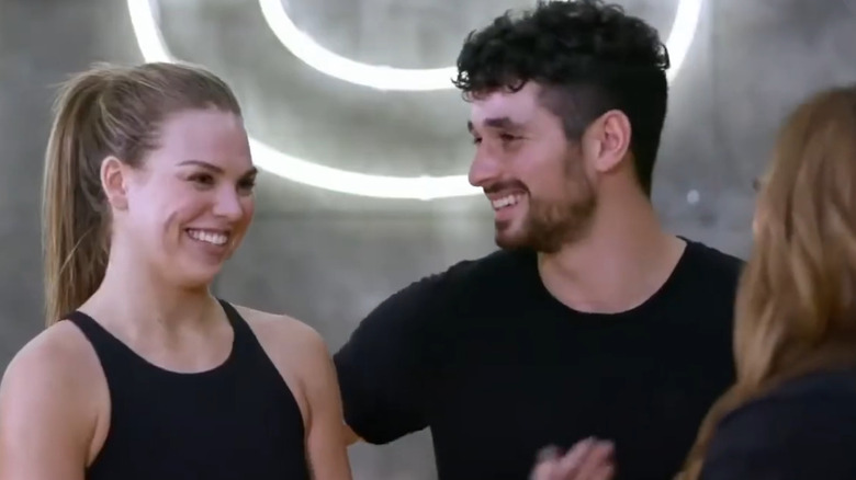 Hannah Brown and Alan Bersten in DWTS rehearsals talking to Carrie Ann Inaba