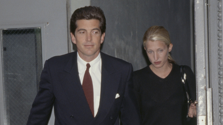 John F. Kennedy and Carolyn Bessette-Kennedy leaving building