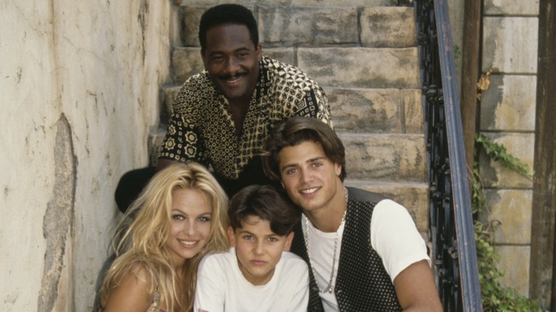 Gregory Alan-Williams, Pamela Anderson, Jeremy Jackson, and David Charvet smiling behind the scenes of Baywatch.