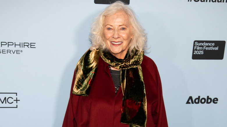 Betty Buckley wearing a red outfit