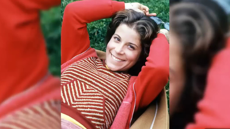 Lani O'Grady lying in grass and smiling