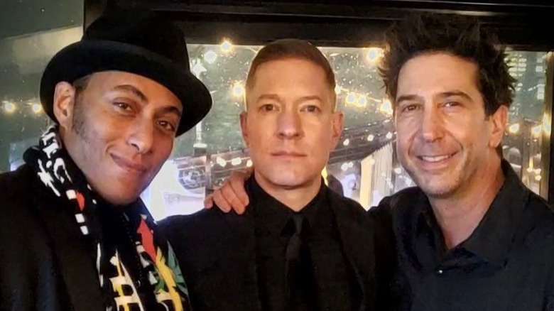 David Schwimmer in all black, with his arm around Joseph Sikora and Athony Fleming.
