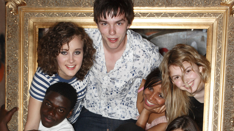 Cast of "Skins" posing in frame