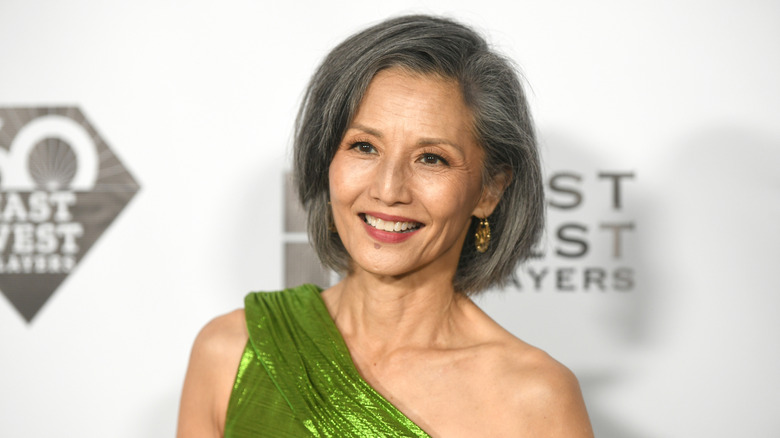 Tamlyn Tomita in green one-shoulder gown
