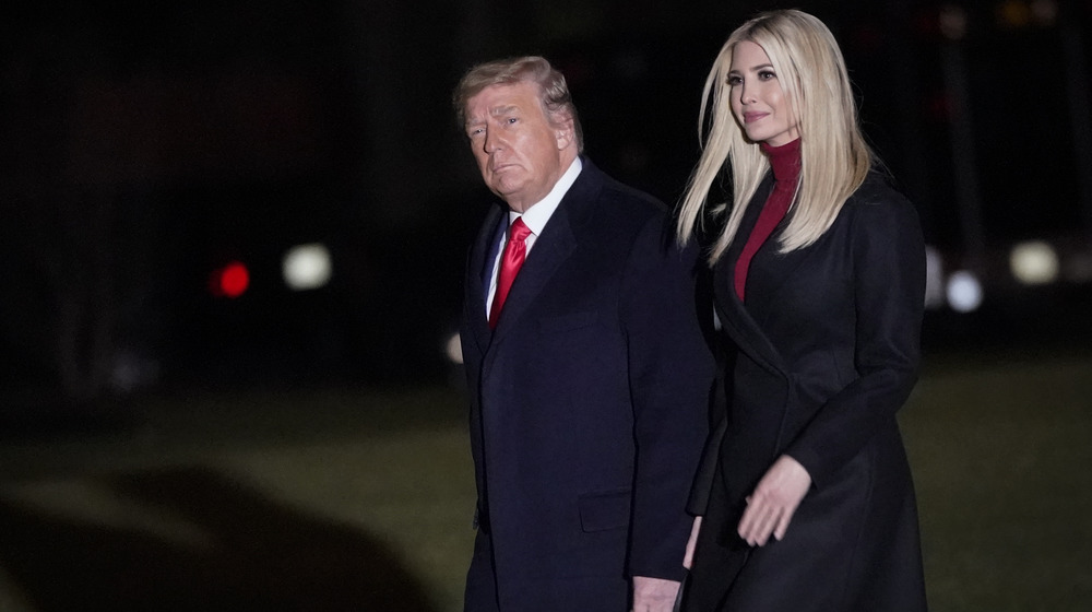 Donald and Ivanka Trump walking at night