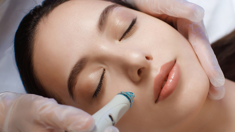 Person getting a hydrafacial treatment