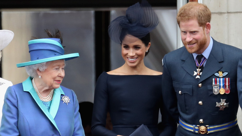 Queen Elizabeth II and Meghan Markle and Prince Harry