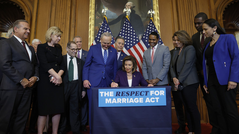 Nancy Pelosi signing the Respect for Marriage Act