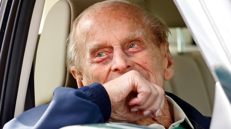 Prince Philip looking deep in thought in the driver's seat