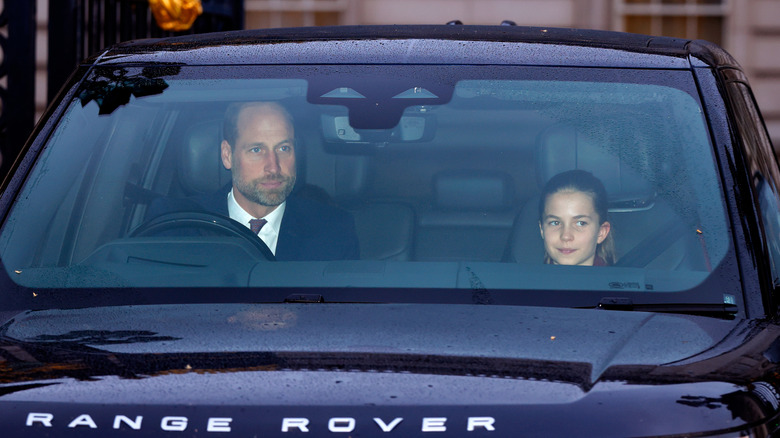 Prince William driving with Princess Charlotte riding shotgun