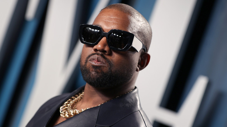 Kanye West pouting in sunglasses