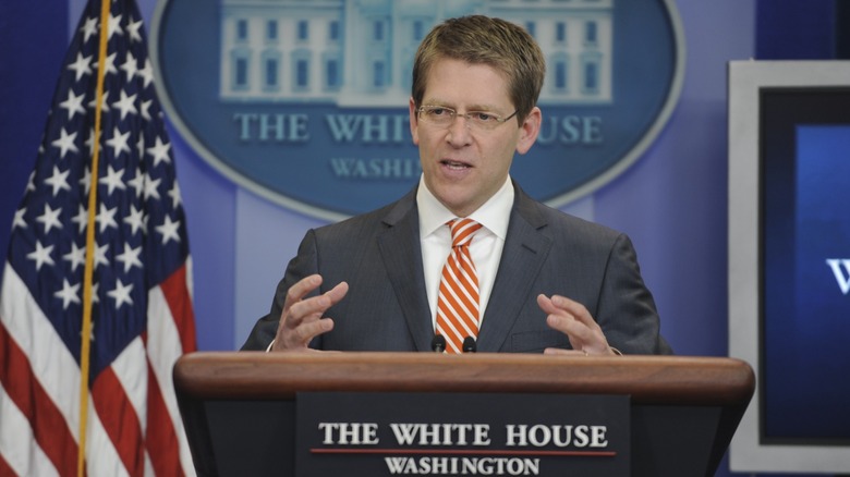 Jay Carney talking at the podium in the White House briefing room