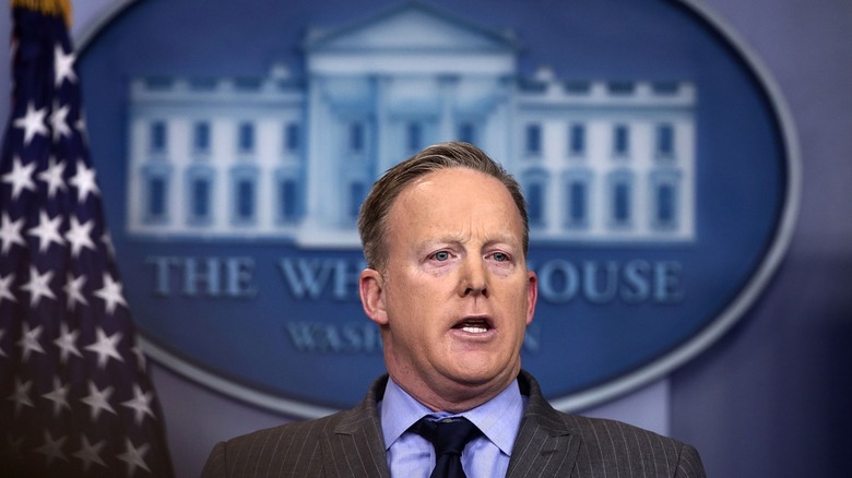 Sean Spicer speaking at the White House press briefing room podium