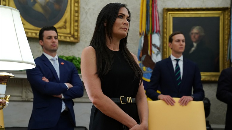 Stephanie Grisham standing in the Oval Office