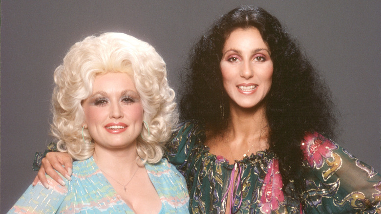 Cher and Dolly Parton smiling in 1978