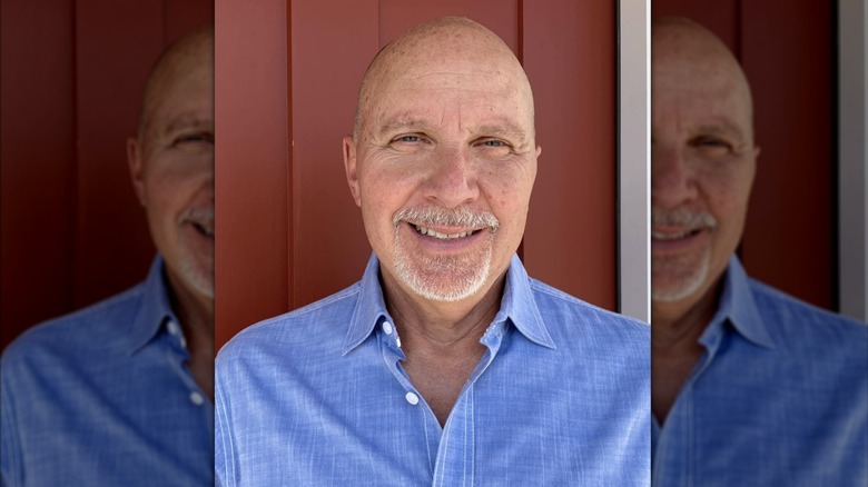 Dan Wheeler smiles for a photo for social media