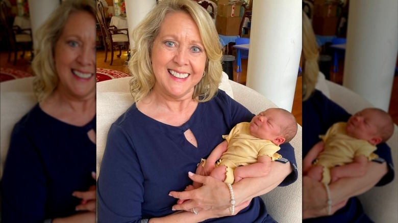 Mary Beth Roe cradles a baby in a Facebook photo