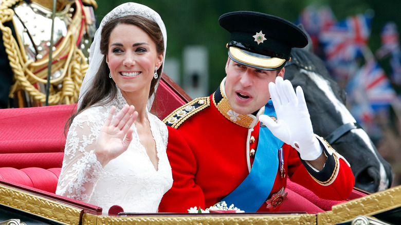 Kate and William riding in wedding carriage