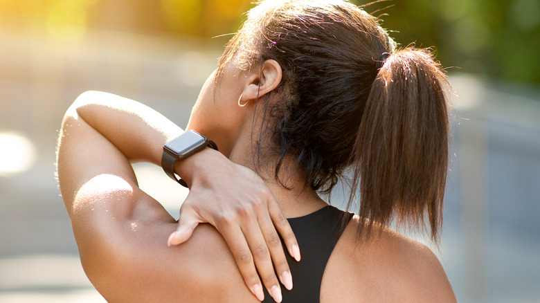 Woman with a muscle cramp