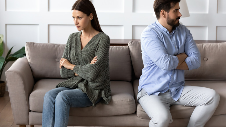 frustrated woman looking away from man
