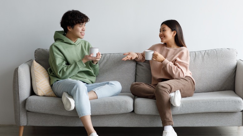 Couple talking on sofa